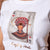 African Queen Of Hearts Crew Tee Pelican